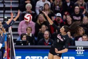 Nebraska Cornhusker opposite Virginia Adriano (9) spikes the ball against the Penn State Nittany Lions in the second set during a volleyball match on Friday, Nov. 28, 2025, in Lincoln, Nebraska. Photo by John S. Peterson.