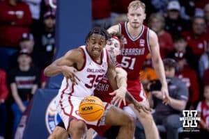 Nebraska Cornhusker guard Sam Hoiberg (1) reaches for the ball against Oklahoma Sooner forward Derrion Reid (35) in the first half during a college men’s basketball game on Saturday, Nov 15, 2025, in Sioux Falls, South Dakota. Photo by John S. Peterson.
