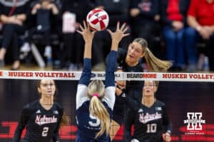 Nebraska Cornhusker middle blocker Andi Jackson (15) spikes the ball against Penn State Nittany Lion middle blocker Jordan Hopp (5), a Nebraska native, in the third set during a volleyball match on Friday, Nov. 28, 2025, in Lincoln, Nebraska. Photo by John S. Peterson.