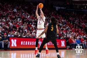 Nebraska Cornhusker forward Braden Frager (5) makes a three-point shot against Winthrop Eagle guard Josh Meo (3) in the first half during a college basketball game on Tuesday, Nov. 25, 2025, in Lincoln, Nebraska. Photo by John S. Peterson.