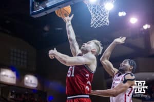 Nebraska Cornhusker forward Rienk Mast (51) makes a lay up against Oklahoma Sooner forward Mohamed Wague (5) in the second half during a college men’s basketball game on Saturday, Nov 15, 2025, in Sioux Falls, South Dakota. Photo by John S. Peterson.