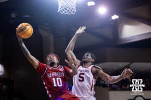 Nebraska Cornhusker guard Jamarques Lawrence (10) drive to the basket against Oklahoma Sooner forward Mohamed Wague (5) in the second half during a college men’s basketball game on Saturday, Nov 15, 2025, in Sioux Falls, South Dakota. Photo by John S. Peterson.