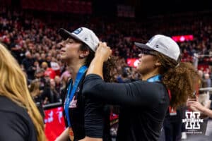 Rebekah Allick helps Virginia Adriano get her hat on celebrating the Big Ten Championship after the volleyball match against the Penn State Nittany Lions on Friday, Nov. 28, 2025, in Lincoln, Nebraska. Photo by John S. Peterson.