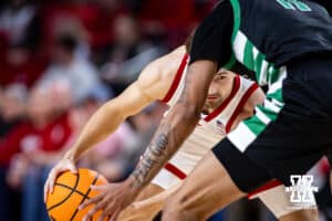 Nebraska Cornhusker guard Sam Hoiberg (1) guards the ball against South Carolina Upstate Spartan forward Learic Davis (11) in the second half during a college basketball game on Saturday, November 29, 2025, in Lincoln, Nebraska. Photo by John S. Peterson.
