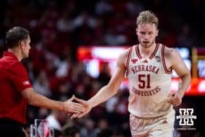 Nebraska Cornhusker forward Rienk Mast (51) gives coach Hoiberg five when taking the bench for a breather against the Winthrop Eagles in the second half during a college basketball game on Tuesday, Nov. 25, 2025, in Lincoln, Nebraska. Photo by John S. Peterson.