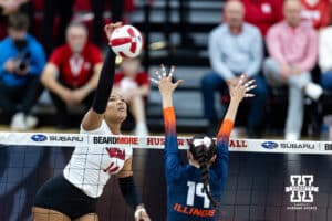 Nebraska Cornhusker middle blocker Manaia Ogbechie (14) spikes the ball against Illinois Fighting Illini outside hitter Alyssa Aguayo (19) in the third set during a college volleyball match on Thursday, November 6, 2025, in Lincoln, Nebraska. Photo by John S. Peterson.