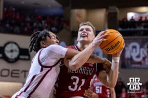 Nebraska Cornhusker guard Cale Jacobsen (31) gets fouled by Oklahoma Sooner forward Mohamed Wague (5) in the second half during a college men’s basketball game on Saturday, Nov 15, 2025, in Sioux Falls, South Dakota. Photo by John S. Peterson.