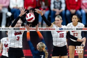 Nebraska Cornhusker opposite Allie Sczech (3) and middle blocker Andi Jackson (15) block Illinois Fighting Illini setter Kenna Phelan (7) in the third set during a college volleyball match on Thursday, November 6, 2025, in Lincoln, Nebraska. Photo by John S. Peterson.