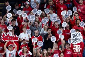 Nebraska Cornhuskers students holding 350th Sellout signs at a break in the action against the Iowa Hawkeyes during a college volleyball match on Thursday, Nov. 20, 2025, in Lincoln, Nebraska. Photo by John S. Peterson.