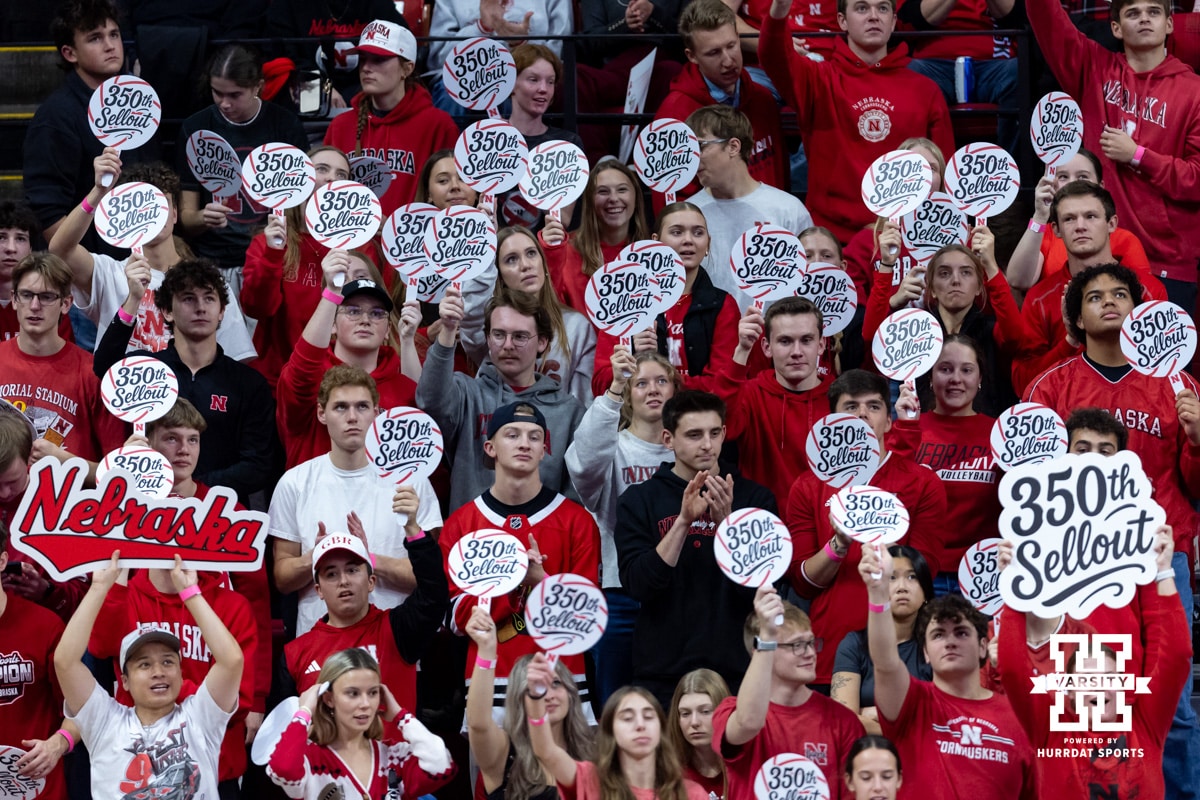 Nebraska Cornhuskers students holding 350th Sellout signs at a break in the action against the Iowa Hawkeyes during a college volleyball match on Thursday, Nov. 20, 2025, in Lincoln, Nebraska. Photo by John S. Peterson.