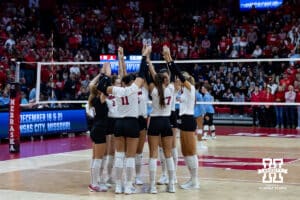Nebraska Cornhuskers huddle on the court at the start of the match against the LIU Sharks in the first set during the first round of the NCAA volleyball tournament on Friday, Dec. 5, 2025, in Lincoln, Nebraska. Photo by John S. Peterson.