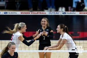 Nebraska Cornhusker middle blocker Andi Jackson (15) celebrates a kill with setter Bergen Reilly (2) against the Ohio State Buckeyes during a volleyball match on Saturday, Nov. 29, 2025, in Lincoln, Nebraska. Photo by John S. Peterson.