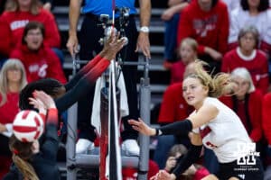 Nebraska Cornhusker opposite Allie Sczech (3) spikes the ball past the Ohio State Buckeyes blockers for a kill during a volleyball match on Saturday, Nov. 29, 2025, in Lincoln, Nebraska. Photo by John S. Peterson.