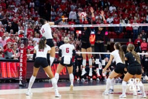 Nebraska Cornhusker outside hitter Teraya Sigler (11) spikes the ball for match point against the Ohio State Buckeyes during a volleyball match on Saturday, Nov. 29, 2025, in Lincoln, Nebraska. Photo by John S. Peterson.