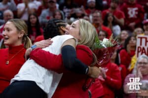 Nebraska Cornhusker outside hitter Taylor Landfair (12) hugs coach Dani Busboom Kelly for senior day after win over Ohio State Buckeyes on Saturday, Nov. 29, 2025, in Lincoln, Nebraska. Photo by John S. Peterson.