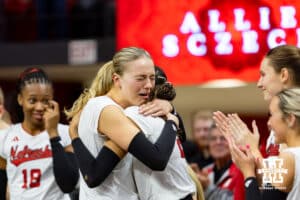 Nebraska Cornhusker opposite Allie Sczech (3) gives Skyler Pierce a hug for senior day after a win over the Ohio State Buckeyes on Saturday, Nov. 29, 2025, in Lincoln, Nebraska. Photo by John S. Peterson.