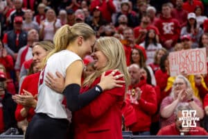 Nebraska Cornhusker opposite Allie Sczech (3) gives coach Dani Busboom Kelly a hug for senior day after a win over the Ohio State Buckeyes on Saturday, Nov. 29, 2025, in Lincoln, Nebraska. Photo by John S. Peterson.