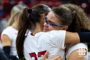 Nebraska Cornhusker middle blocker Rebekah Allick gives Harper Murray a hug for senior day after a win over the Ohio State Buckeyes on Saturday, Nov. 29, 2025, in Lincoln, Nebraska. Photo by John S. Peterson.